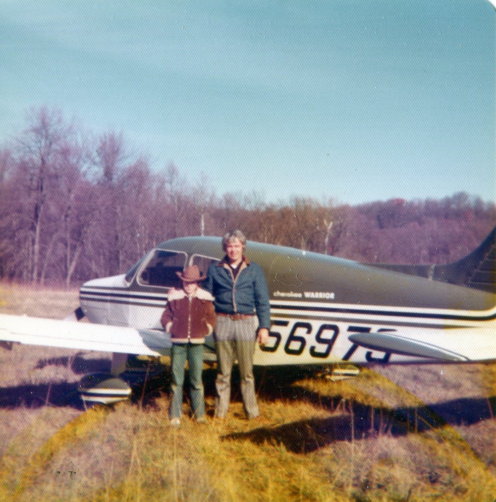 Me and my dad, Christmas eve, 1976 beside Piper Cherokee Warrior he trained in for his commercial rating